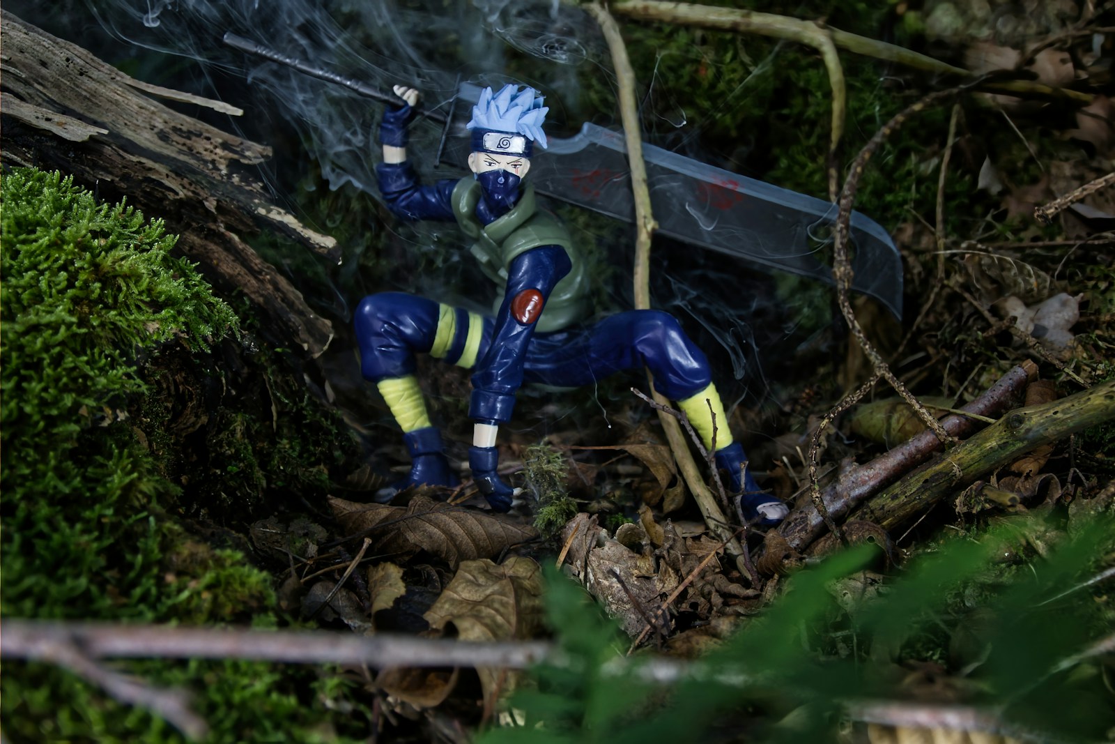 A toy is standing in the woods with a knife